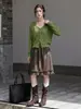 Falda midi de cuero lisa y versátil de Feiyuan con volantes para mujer, nueva falda elegante de línea A para commuting de principios de otoño