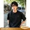 Camiseta básica versátil de manga corta, de marca moderna, para verano, simple, bordada, de cuello redondo, para hombres y mujeres, corte holgado, en blanco y negro