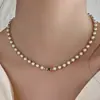 Collar de perlas de doble capa estilo retro francés para mujer, ligero, lujoso, de alta gama, con cadena para el cuello.