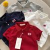 Polo para Niños 2026 Ojos Entrecerrados Verano Nuevo Producto Niños y Niñas Polo de Manga Corta con Forma de Corazón Camiseta Estilo Japonés para Bebé con Cuello Campana