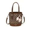 Bolso cubeta de lunares estilo coreano 2026 nuevo, un bolso de mano y bandolera retro para mujer, versátil, de nicho, de alta gama y bolso cruzado casual