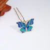 Antiguo nuevo gota de aceite imitación azul cloisonné mariposa color pasador de pelo Hanfu aleación tocado accesorios fabricantes venta al por mayor