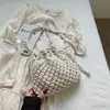Bolso de paja tejida para mujer, nueva tendencia de moda 2025, diseño de nicho, bandolera tipo cubo, bolso de playa para todo tipo de combinaciones.