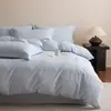 Estilo de lujo ligero juego de cuatro piezas de bordado jacquard 100% algodón puro funda nórdica de algodón de fibra larga sábana bajera ropa de cama para dormitorio principal
