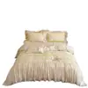 Estilo romántico francés femenino Tencel de algodón ultra suave con volantes y encaje color crema juego de ropa de cama casual de cuatro piezas