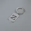 Venta Caliente de Productos Nuevos Transfronterizos 26 Letras Inglesas Huecas de Acero de Titanio Sin Decoloración Accesorios de Joyería Llavero 26 Letras