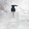 Botella de loción con boca de tornillo rayada 180ml Botella con cabeza de bomba de presión Botella de vidrio Botella de loción vacía transparente