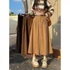 Saia midi de veludo cotelê estilo retrô para primavera e verão, uma tendência quente para mulheres com corpo tipo pera, projetada para cobrir os quadris e criar um efeito emagrecedor, com barra larga