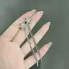 Pendientes de borla con copo de nieve incrustado de diamantes exquisitos franceses estilo elegante de socialité atmósfera un dos en uno sensación de lujo ligero de alta gama pendientes