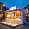Contenedor fresco y sencillo para tienda de té y bebidas, barra larga con asientos, tienda modular de comida ligera para zonas escénicas y parques