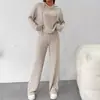 Nuevo estilo de comercio exterior 2026, conjunto de punto a rayas holgado con capucha, ropa casual de manga larga, estilo europeo y americano, venta al por mayor de ropa para mujer