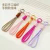 Nuevo cordón trenzado hecho a mano para teléfono, diseño de bloques de color bicolor, correa de muñeca anudada, cordón corto, antipérdida y antirrobo, elegante y atractivo