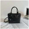 Bolsa Cruzada Nueva de Verano 2026 Estilo Coreano Bolso de Mano Simple Bolso Cubo Minimalista de Moda Bolso de Hombro Texturizado Elegante