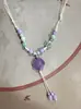 Collar con colgante de campana de mariposa de cerámica de estilo étnico retro para mujer, diseño nuevo y moderno, cadena larga para suéter, accesorios