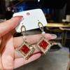 Pendientes de lazo de terciopelo rojo con ambiente de moda, temperamento femenino, flor dulce, borla larga, pendientes Joker al por mayor