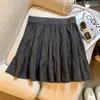 Foto real de una falda de punto blanca estilo ballet para mujer, nuevo modelo otoño e invierno 2026, falda corta abullonada de línea A para petite