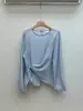 Camisa adelgazante de cintura alta estilo coreano chic 2026 primavera/otoño versión coreana irregular semitransparente jersey de cuello redondo