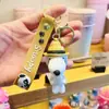 Novo chaveiro de desenho animado do Snoopy pingente de bolsa de casal chaveiro de carro boneca de borracha macia pequeno presente atacado