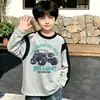 Camiseta de manga larga de algodón puro para niños, moda de primavera y otoño, capa base para niños, cuello redondo de dibujos animados, top holgado estampado versátil, camiseta moderna