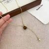 Diseño sentido piedra ojo de tigre otoño e invierno suéter largo cadena 2024 nuevo temperamento ligero lujo alta gama collar accesorios de mujer