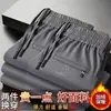 Calça casual masculina de alta qualidade para outono e inverno, com forro de fleece, corte reto solto e cintura elástica, para uso transfronteiriço