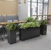 Caja de flores de acero inoxidable para exteriores combinación soporte de flores de hierro departamento de ventas valla de plantación verde partición canaleta para flores cama de flores exterior de restaurante