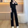 Conjunto de moda casual de alta gama para mujer, nuevo estilo chino de otoño, con una sudadera abotonada y pantalones anchos estampados, un conjunto de dos piezas moderno