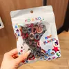 100 Piezas Gomas para el Cabello de Margarita Sencillas Empaquetadas en Bolsa Bandas de Goma de Nylon Coloridas Anillos de Toalla Accesorios de Cabello de Moda Cuerdas para el Cabello Lote