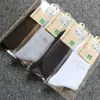 Calcetines para hombre de tubo medio empaque individual otoño e invierno color liso grosor medio casual de negocios calcetines de algodón fabricantes venta al por mayor calcetines para hombre