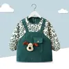 Babero de terciopelo de cristal para bebé, impermeable, antidesgaste, con bolsillo de arroz, para otoño e invierno, delantal para madre y bebé.