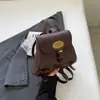 Mochila Pequena Feminina Retrô 2026 Nova Elegante Bolsa de Ombro Duplo Moda Coreana Versátil Pequena Bolsa Transversal Simples Bolsa Feminina Tendência