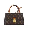Bolso pequeño de alta gama cruzado para mujer 2026 Otoño/Invierno Nuevo Bolso de Hombro de Mano con Monograma Bolso Cruzado Versátil de Moda