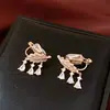 Pendientes de Clip con Borla de Hoja de Zirconia Bañados en Oro Real para Mujer Sin Agujeros en las Orejas, Pendientes de Estilo Lujo Ligero, Pendientes de Alta Gama Modernos y Elegantes