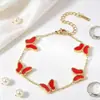 Fabricante de conjunto de joias de concha e borboleta estilo francês transfronteiriço, combinação de colar, pulseira e brinco de nicho de alta qualidade para mulheres