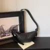 Diseño de nicho transfronterizo bolsa simple para croissant mujer 2026 nuevo estilo textura retro bolsa de albóndigas de moda bandolera bolso de hombro