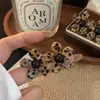 Pendientes de botón con estampado de leopardo y flores de temperamento único Diseño de nicho Pendientes de lujo ligero Pendientes de moda Versátiles Personalidad Pendiente exquisito