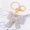 Llavero de Arco de Arcilla Cordón de Cuero Pequeño Regalo Pedrería Colgante de Llave de Metal Yiwu Pequeño Artículo Mayorista Transfronterizo