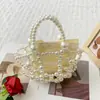 Bolsa de Miçangas Artesanal Elegante e na Moda 2025 Nova Bolsa de Mão Princesa com Pérolas de Imitação de Nicho Bolsa de Festa Estilosa