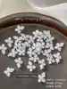 Decoraciones para uñas de flor de cristal de hielo tallada suave, modernas y versátiles, blanco translúcido, flor de cuatro pétalos tridimensional para decoración de uñas, pedrería de resina, al por mayor