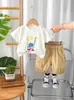 2025 Nuevo Verano Niños Cuello Redondo Estampado de Caricaturas con Letras Manga Corta Traje de Shorts Casual Fabricante Mayorista