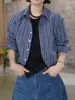 Camisa de manga larga con cuello polo a cuadros estilo coreano y dobladillo curvo para mujer, nuevo diseño de principios de otoño, top adelgazante y versátil