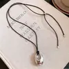 Colar de cordão de couro estilo coreano ins com pingente oval, simples, moderno, casual, corrente versátil para a clavícula, acessório requintado e único