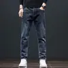 Jeans rectos de ajuste slim de alta gama en negro y gris para hombre de Hong Kong, nuevos pantalones largos casuales elásticos de otoño para uso en exteriores