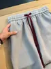 Calça casual de blocos de cor texturizada estilo americano para homens, fina para o outono, com múltiplos bolsos, respirável, perna reta, solta, perna larga