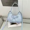 Bolsa de axila fofa estilo coreano com laço artístico transfronteiriça 2026 bolsa tote grande capacidade para o dia a dia, transversal, de ombro