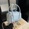 Nova Bolsa Pequena Estilosa de Início de Primavera Feminina 2025 Nova Moda Bolsa Transversal Nicho Portátil Bolsa de Trabalho