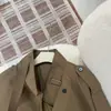 Gabardina de alta gama estilo británico con cuello alto y doble botonadura para mujer, chaqueta corta casual retro adelgazante de algodón Lyocell