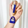 Llavero de bolso con incrustaciones de diamantes de arcilla transfronterizo, lleno de diamantes, accesorio de llavero de coche deslumbrante de alta gama