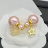 Pendientes Reversibles Dior/Dior 2025 Estilo Dulce Nuevo Letra Cd Nariz de Cerdo Estrella de Cinco Puntas Perla Rosa