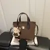 Alto Valor Estético Fofo Embossado 2026 Verão Novo Estilo Simples Moda Textura Versátil Tendência Bolsa de Ombro Cruzada de Mão